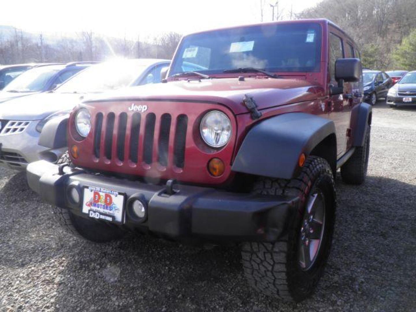 2011 RED Jeep Wrangler Unlimited Rubicon 4WD (1J4HA6H11BL) with an 3.8 V6 engine, located at 19521 New George's Creek Rd SW, Barton, MD, 21521, (301) 463-2404, 39.524323, -79.017906 - Photo#0