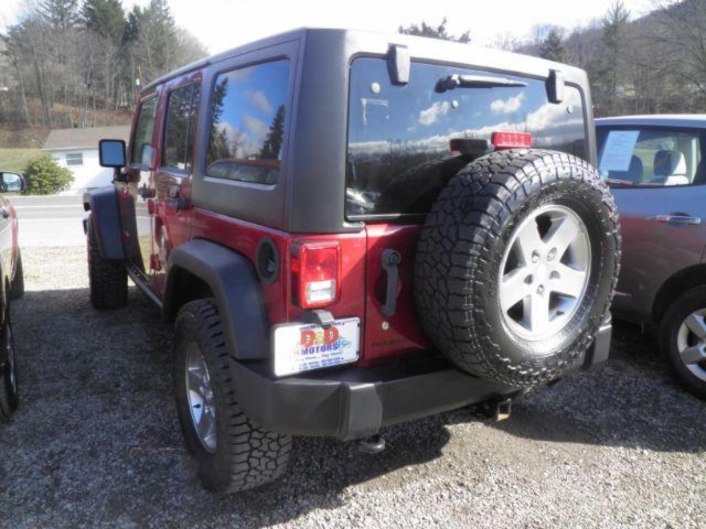 2011 RED Jeep Wrangler Unlimited Rubicon 4WD (1J4HA6H11BL) with an 3.8 V6 engine, located at 19521 New George's Creek Rd SW, Barton, MD, 21521, (301) 463-2404, 39.524323, -79.017906 - Photo#5