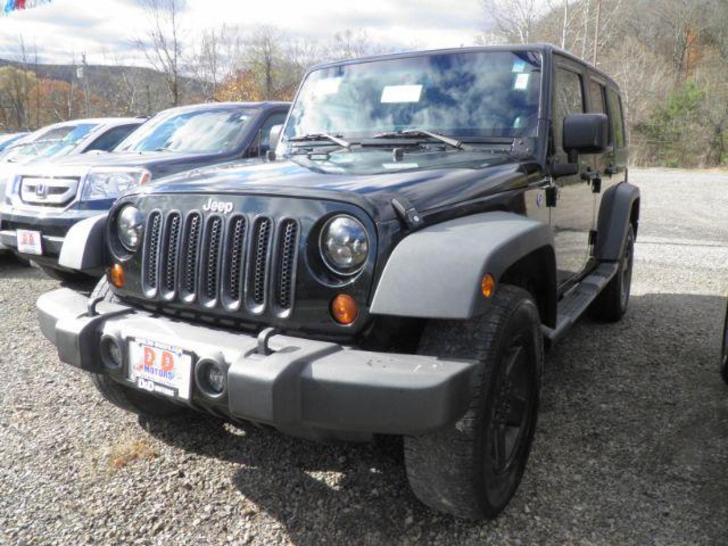 2012 Black Jeep Wrangler Unlimited Sport 4WD (1C4HJWDG5CL) with an 3.6L V6 engine, located at 19521 New George's Creek Rd SW, Barton, MD, 21521, (301) 463-2404, 39.524323, -79.017906 - Photo#0