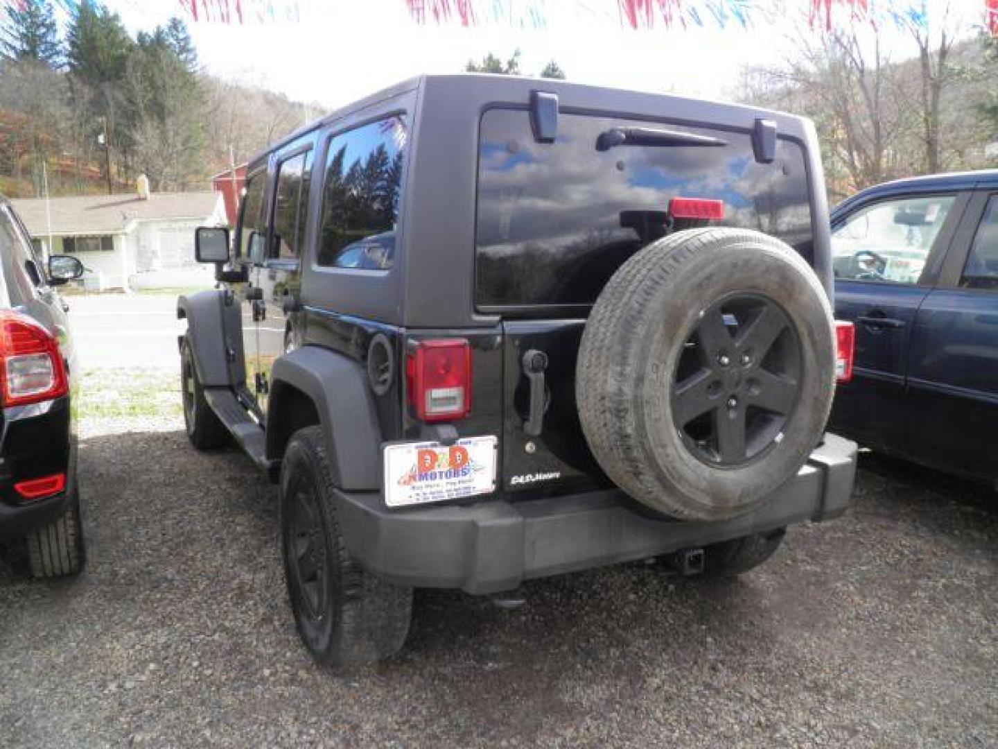 2012 Black Jeep Wrangler Unlimited Sport 4WD (1C4HJWDG5CL) with an 3.6L V6 engine, located at 19521 New George's Creek Rd SW, Barton, MD, 21521, (301) 463-2404, 39.524323, -79.017906 - Photo#6