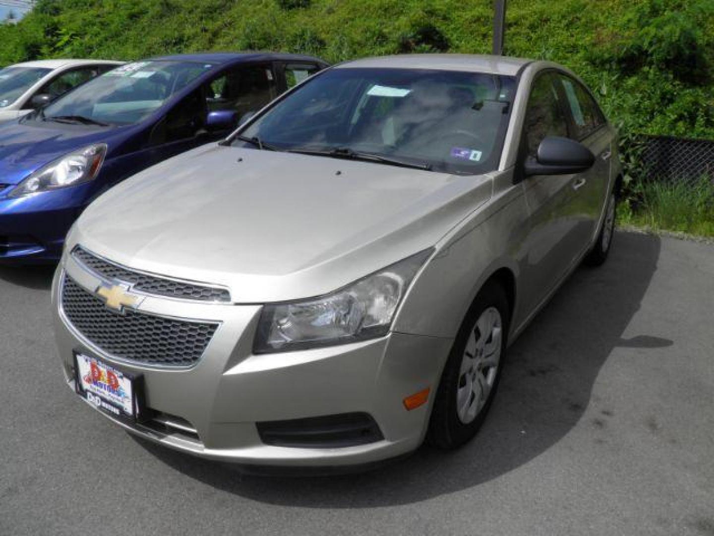 2014 GOLD Chevrolet Cruze LS Auto (1G1PA5SHXE7) with an 1.8l L4 engine, AT transmission, located at 15520 McMullen Hwy SW, Belair, MD, 21502, (301) 729-3700, 39.581375, -78.846451 - Photo#0