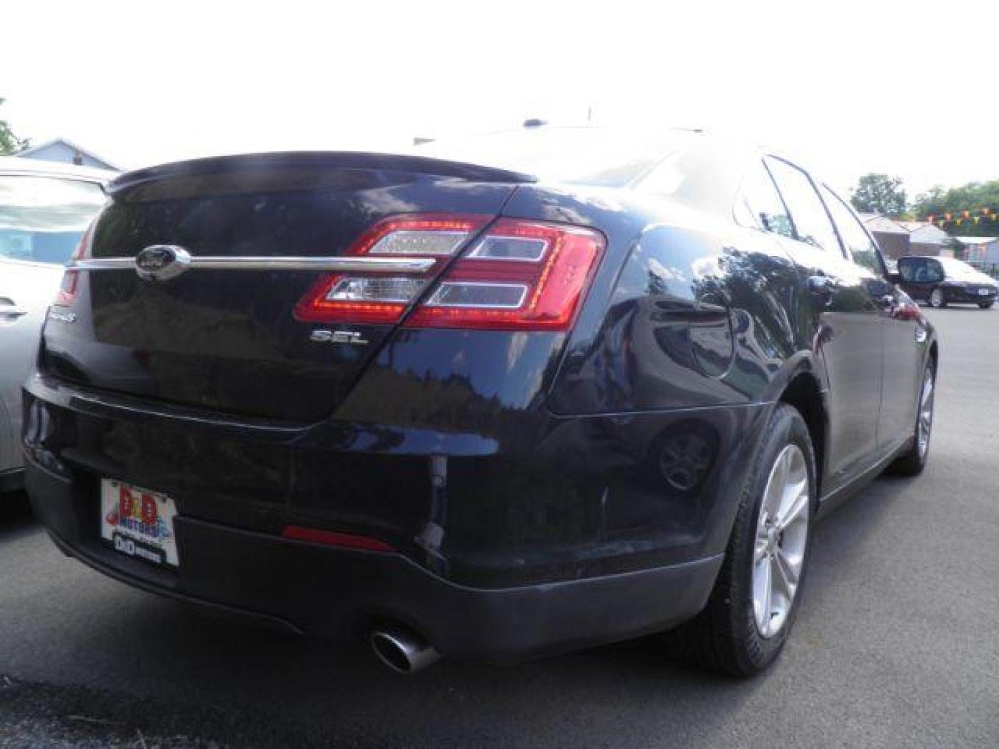 2014 BLACK Ford Taurus SEL FWD (1FAHP2E8XEG) with an 3.5L V6 engine, AT transmission, located at 15520 McMullen Hwy SW, Belair, MD, 21502, (301) 729-3700, 39.581375, -78.846451 - Photo#4