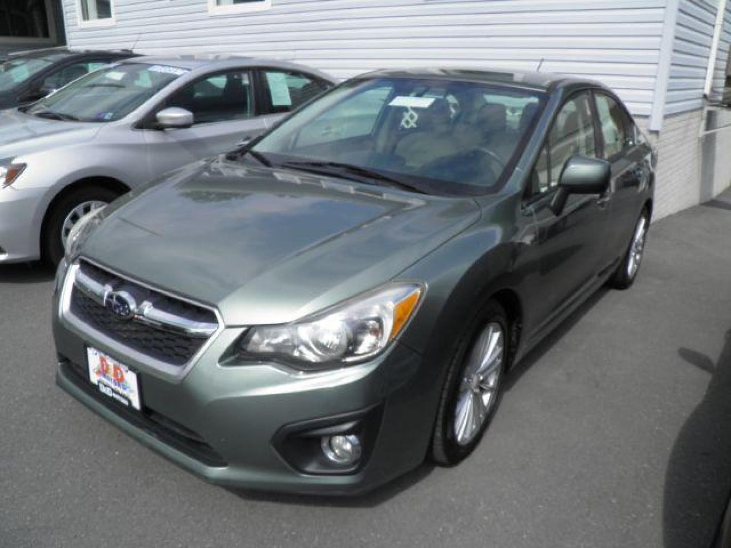 2014 GREEN Subaru Impreza Limited 4-Door (JF1GJAG66EH) with an 2.0L L4 engine, CVT transmission, located at 15520 McMullen Hwy SW, Belair, MD, 21502, (301) 729-3700, 39.581375, -78.846451 - Photo#0