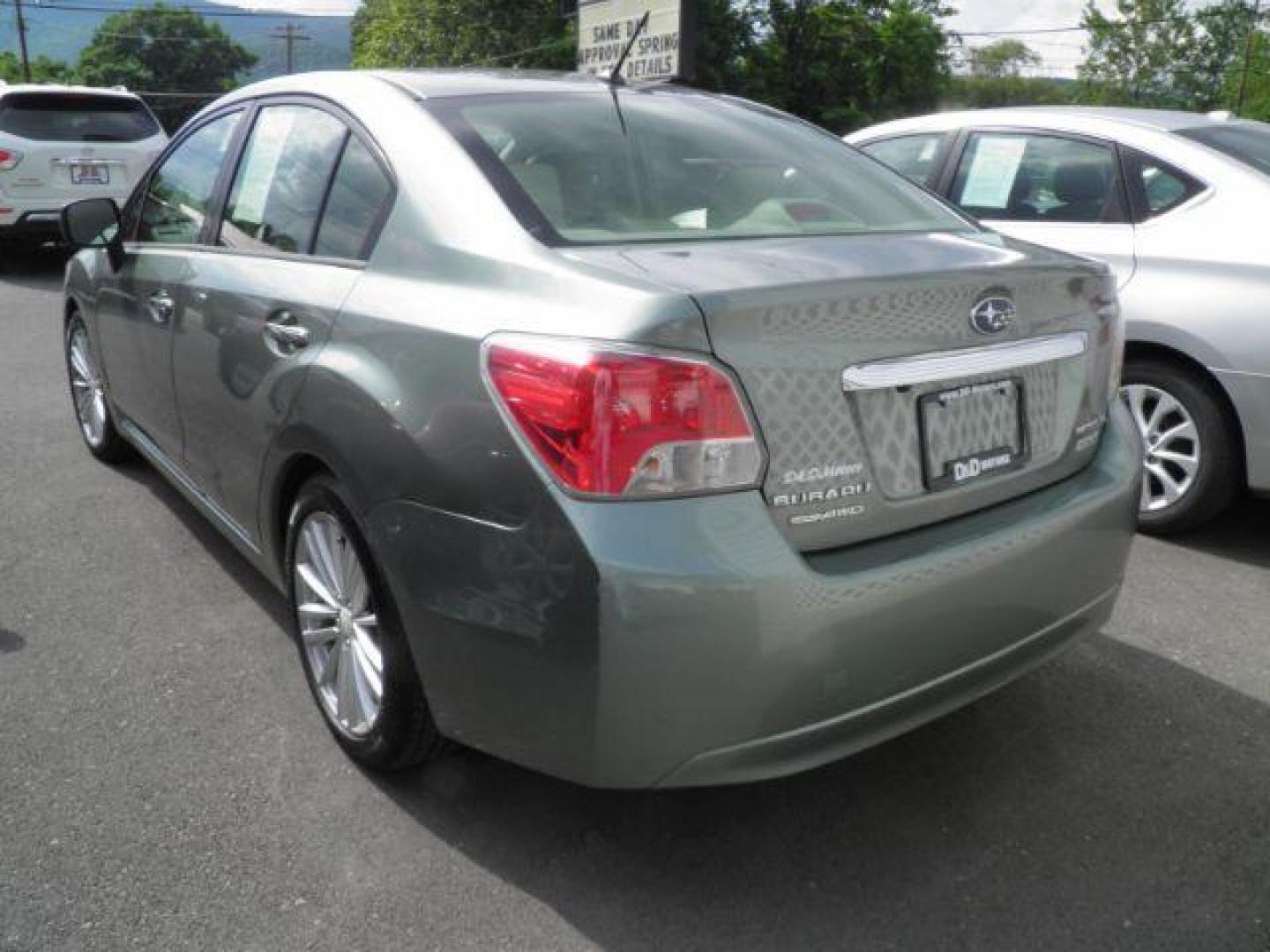 2014 GREEN Subaru Impreza Limited 4-Door (JF1GJAG66EH) with an 2.0L L4 engine, CVT transmission, located at 15520 McMullen Hwy SW, Belair, MD, 21502, (301) 729-3700, 39.581375, -78.846451 - Photo#4