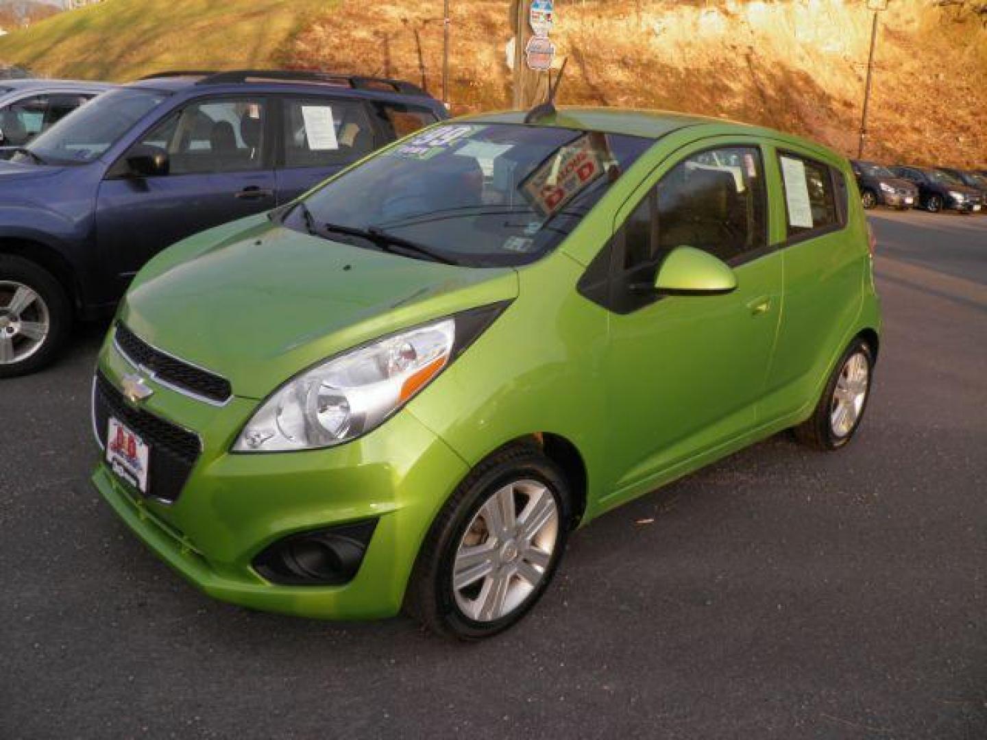 2015 GREEN Chevrolet Spark LS Manual (KL8CA6S9XFC) with an 1.2l L4 engine, 5SP transmission, located at 19521 New George's Creek Rd SW, Barton, MD, 21521, (301) 463-2404, 39.524323, -79.017906 - Photo#0