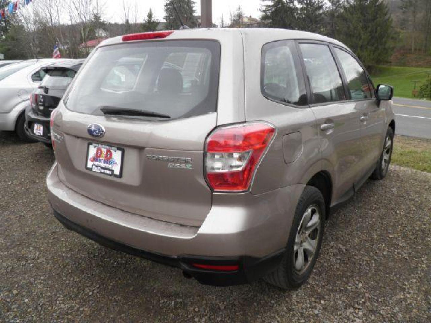 2015 GOLD Subaru Forester 2.5i (JF2SJAAC7FG) with an 2.5 L4 engine, 6SP transmission, located at 19521 New George's Creek Rd SW, Barton, MD, 21521, (301) 463-2404, 39.524323, -79.017906 - Photo#5