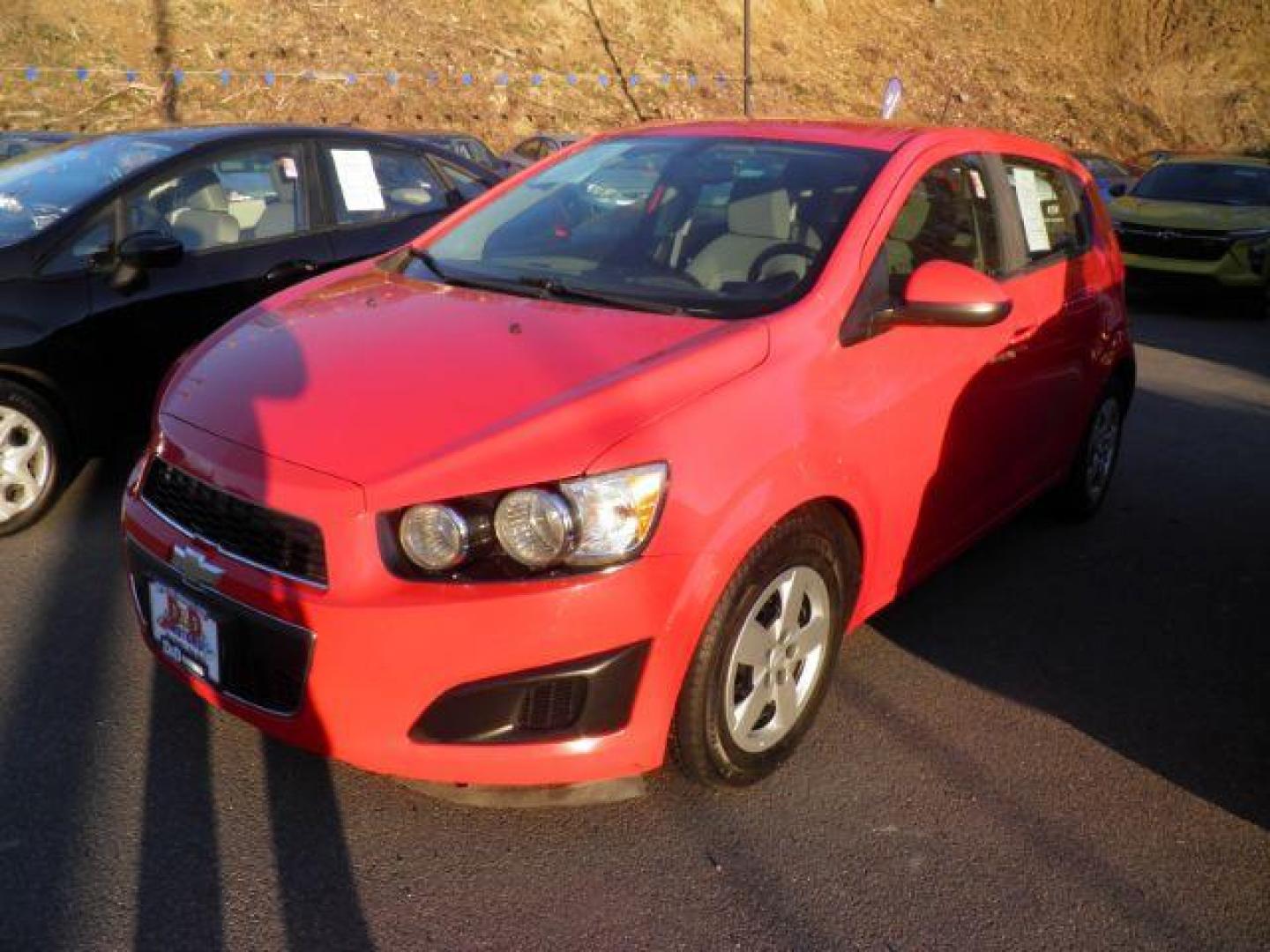 2016 RED Chevrolet SONIC LS Auto 5-Door (1G1JA6SG9G4) with an 1.8L L4 engine, AT transmission, located at 15520 McMullen Hwy SW, Belair, MD, 21502, (301) 729-3700, 39.581375, -78.846451 - Photo#0