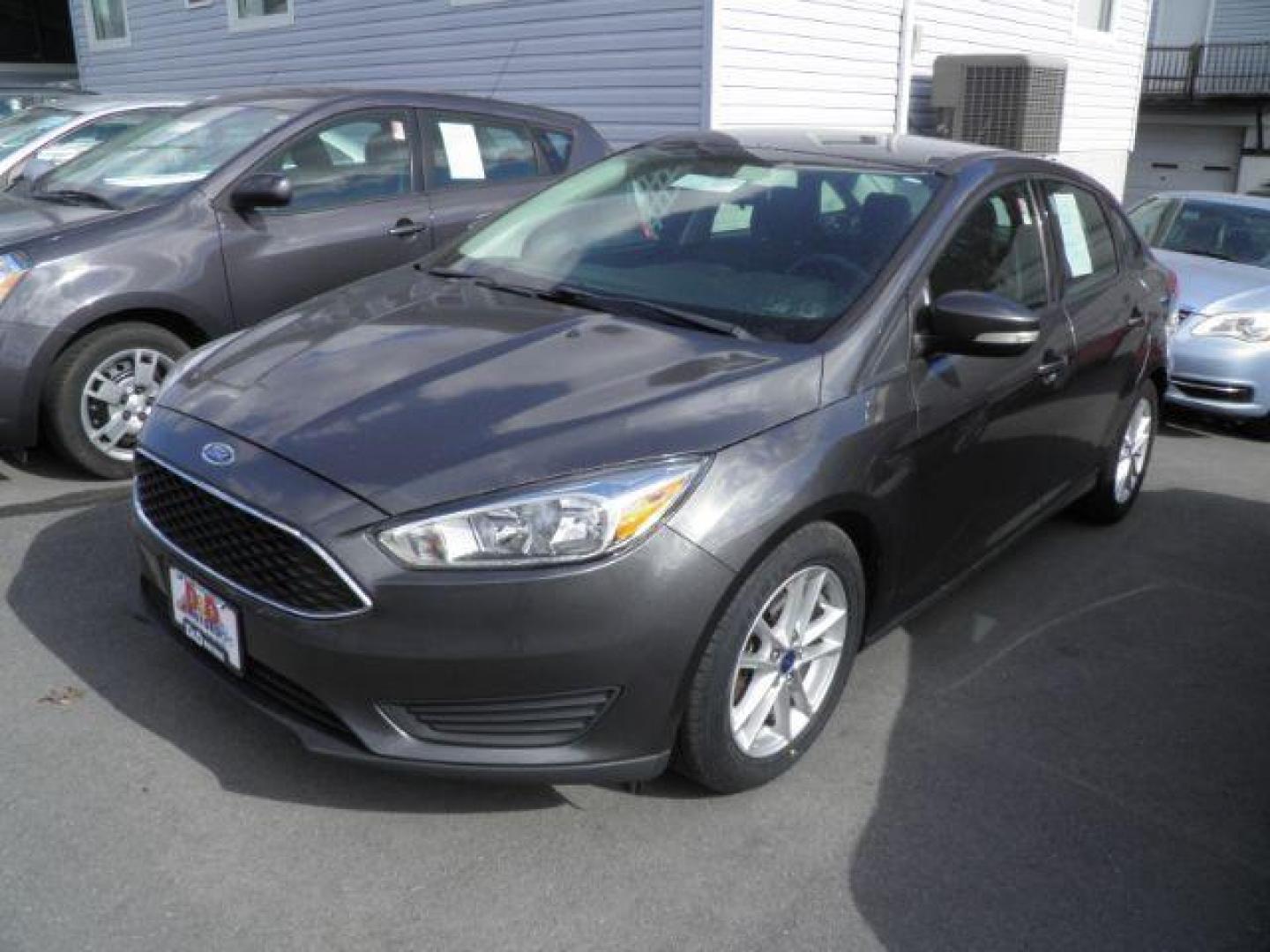 2016 GRAY Ford Focus SE Sedan (1FADP3F29GL) with an 2.0L L4 engine, AT transmission, located at 15520 McMullen Hwy SW, Belair, MD, 21502, (301) 729-3700, 39.581375, -78.846451 - Photo#0