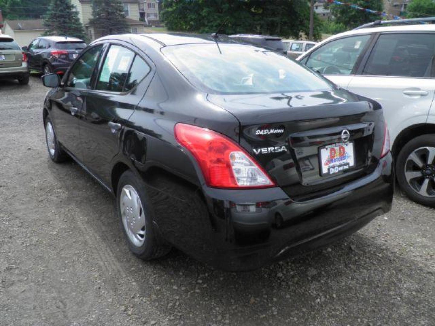 2016 BLACK Nissan Versa 1.6 S 5M (3N1CN7AP4GL) with an 1.6L L4 engine, 5SP transmission, located at 19521 New George's Creek Rd SW, Barton, MD, 21521, (301) 463-2404, 39.524323, -79.017906 - Photo#4