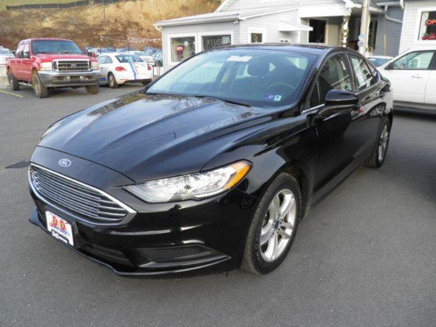 2018 Black /Black Cloth Ford Fusion SE (3FA6P0H77JR) with an 2.5L L4 DOHC 16V engine, AT transmission, located at 15520 McMullen Hwy SW, Belair, MD, 21502, (301) 729-3700, 39.581375, -78.846451 - Photo#0